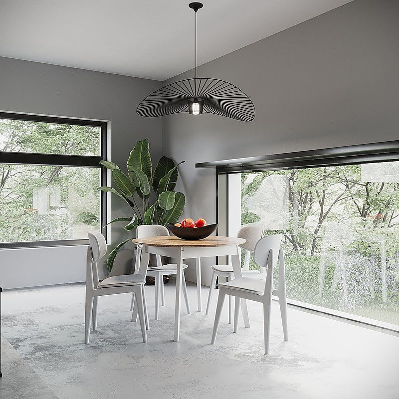 White extendable round dining table with four solid wood dining chairs
